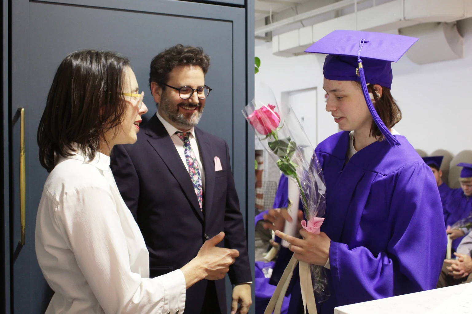 An AVRO Academy graduate celebrating with family on graduation day