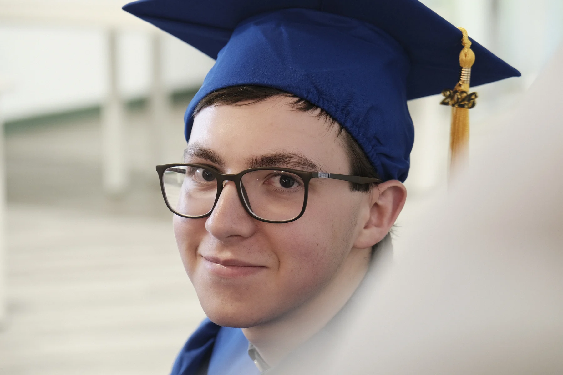 An AVRO Academy graduate smiling on graduation day