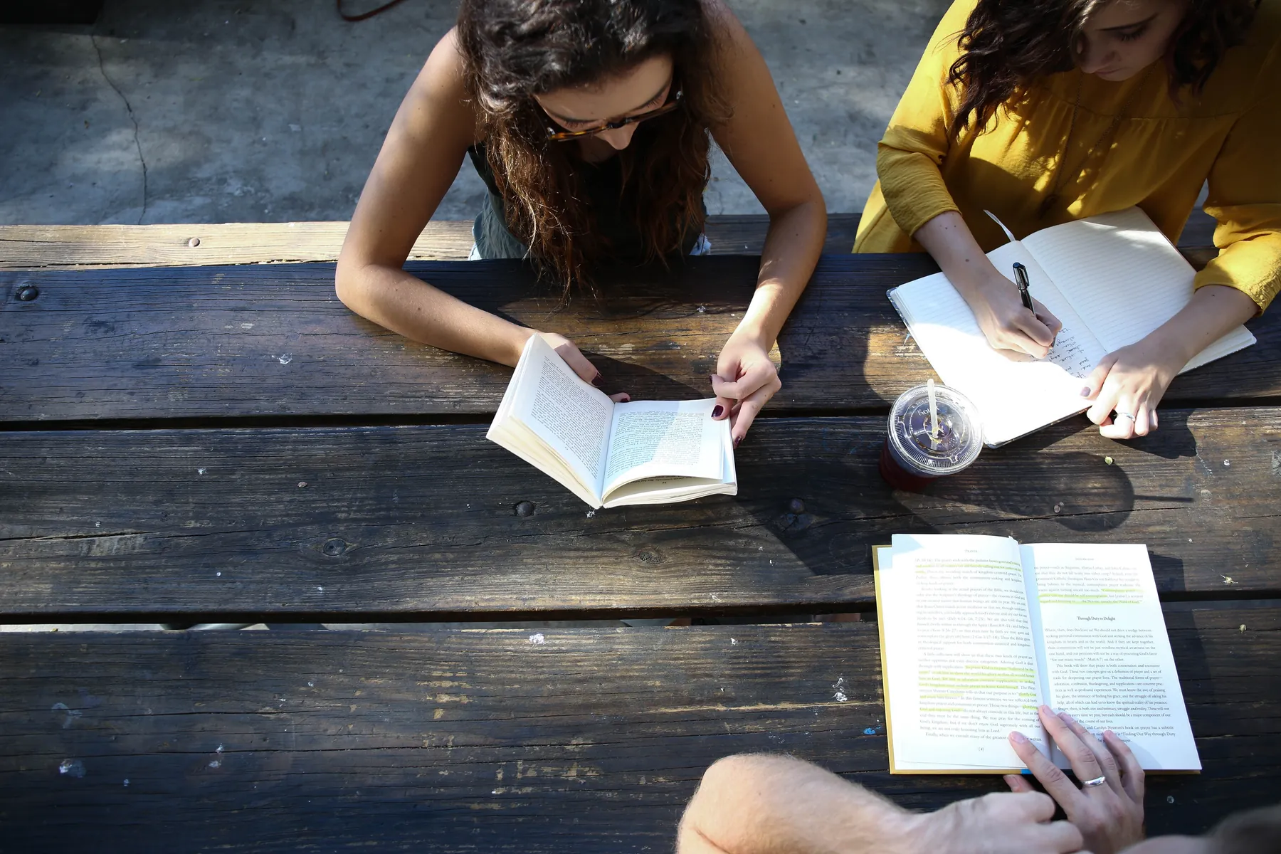 Two AVRO Academy students studying one-to-one at a table