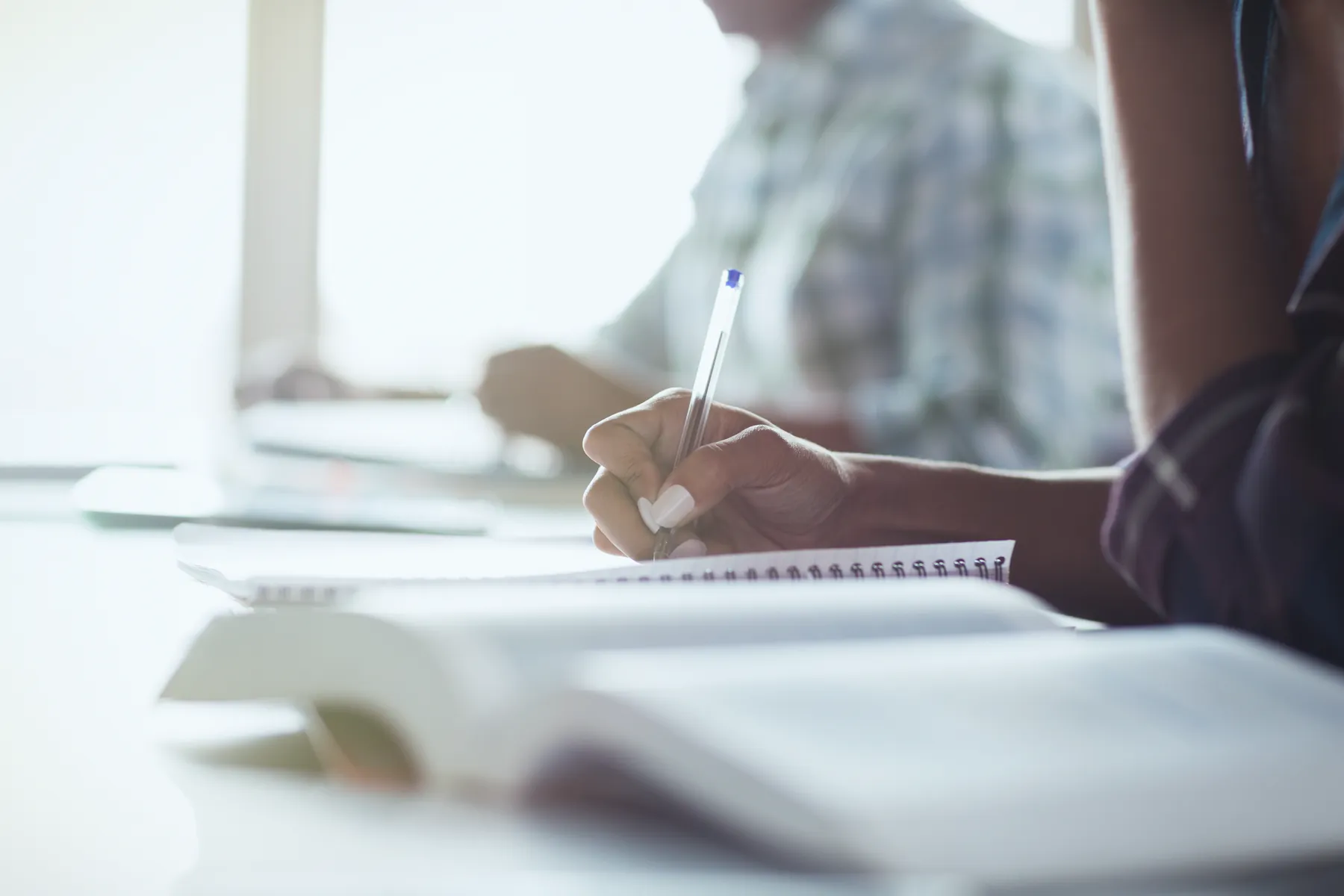 A student focused on written work while retaking a high school credit at AVRO Academy