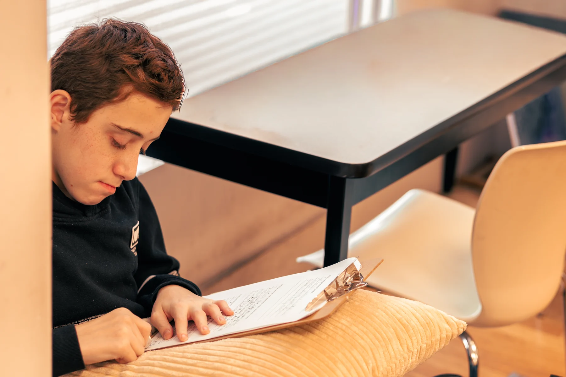 An AVRO Academy student focused on their work